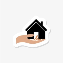 Fototapeta na wymiar Hand holding house sticker. Simple illustration of hand holding house