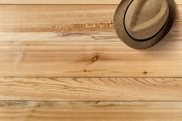 Hat on wooden table. Top view. Summer travel concept element. © Erik Nurshin