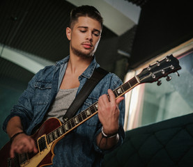 Obraz premium Music band having rehearsal in a studio