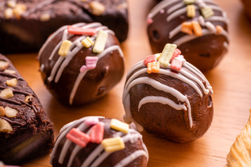 chocolate ball with topping on wooden background