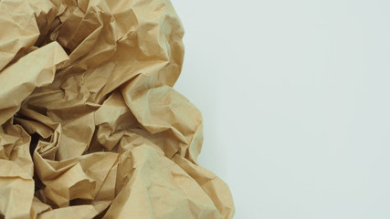 Crumpled brown paper.It is mauled on white background.