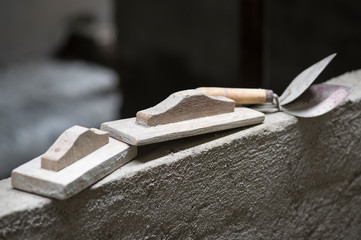 Trowel - Mansion tool used to plaster brick with cement, made of wood and iron.
