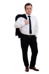Mature caucasian business man 55-60 years old, holding jacket over his shoulder and hand in pocket isolated on white background in full growth. Studio shot.