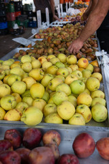 Fruit and vegetable market in Spain. Apples and pears sold on outdoor market. Ripe spanish sesonal farm fruits for sale