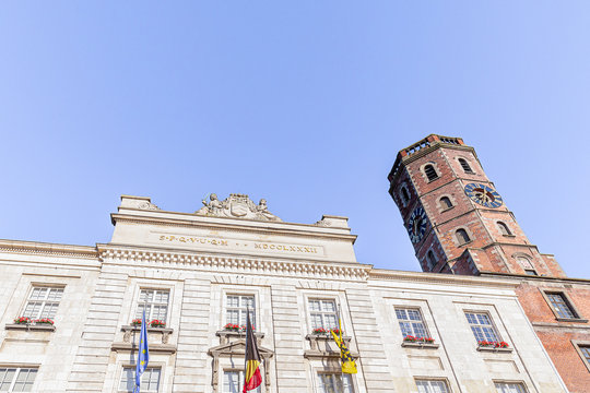 The City of Menen town hall and belfry with blue sky, Flanders, Belgium