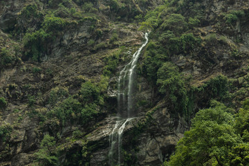 Waterfall in the mountains as seen on the way to Kedarnath Temple in Uttarakhand, India