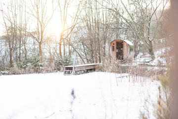 Outdoor wooden sauna in an old wine barrel