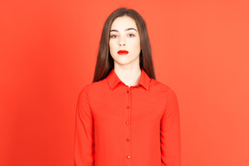 Fototapeta premium portrait of young woman on red background