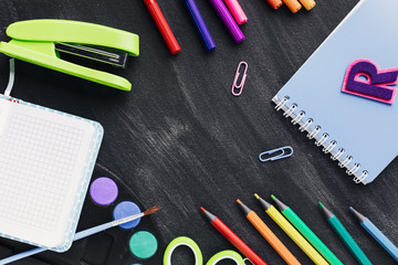 Colourful creative stationery on dark background