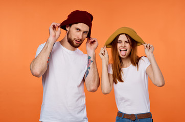 man and woman in hats