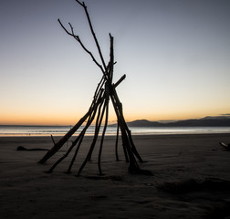 Tee pee on the beach at sunrise