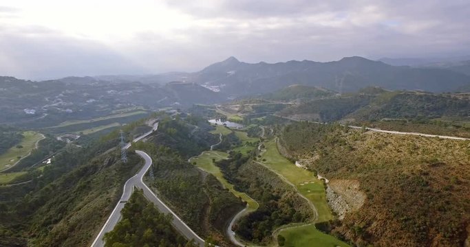 4K Aerial, View on golf course and hairpin bends, Andalusia, Spain