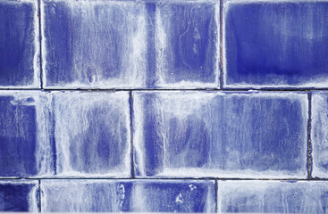 Dark blue tiles with white patina. Swimming pool tile texture