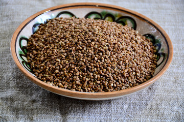  Buckwheat groats in a clay plate