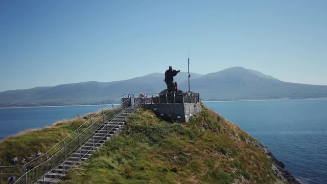 St. Brendan The Navigator statue extreme long orbiting shot, Fenit, County Kerry, Ireland