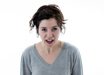 Portrait of a desperate young woman with angry face looking furious. Human expressions and emotions