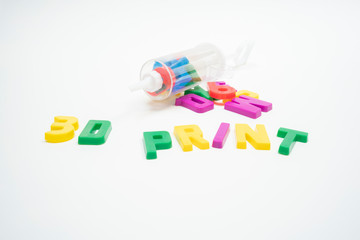 3D printing concept, plastic letters with icing pipe 
