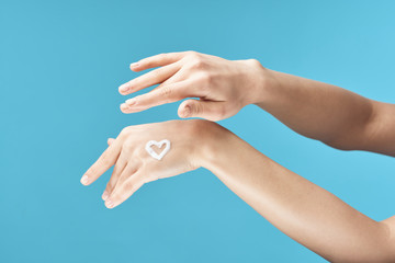 female hands on blue background