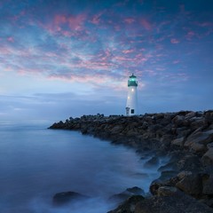 Santa Cruz Breakwater Light (Walton Lighthouse) in Santa Cruz at colorful sunrise, Pacific coast, California, USA Beautiful seascape background 