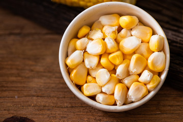 Fresh sweet corn juice (corn milk) and corn on wood background