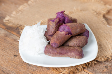 Steamed purple sweet potato in white plate