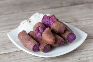 Steamed purple sweet potato in white plate