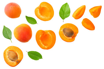 apricot fruits with slices and green leaf isolated on white background. top view
