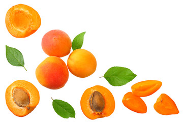 apricot fruits with slices and green leaf isolated on white background. top view