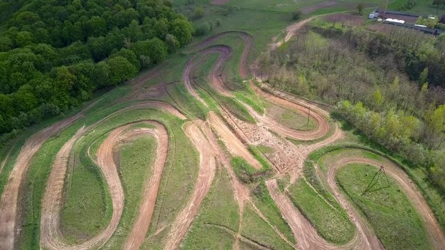 Dirt road tracks in field for motorcycle racing.