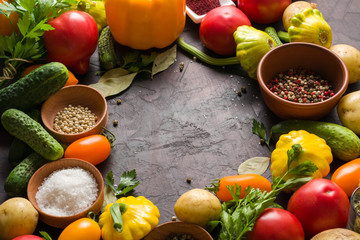 Fresh summer vegetables on the kitchen table. Lay out in the form of a frame for placement inside the text, recipe or photo.