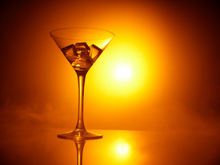 martini glass with ice during sunset