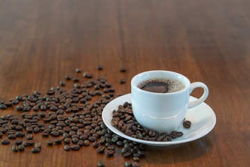 Hot coffee cup with roasted coffee beans