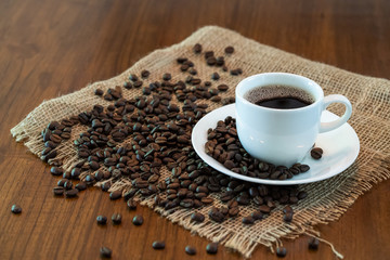 Hot coffee cup with roasted coffee beans