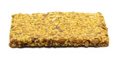 Protein, multi seeds bar with sesame and turmeric, isolated on white background