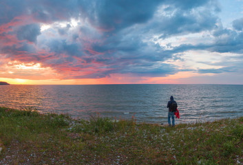 man at sunset by the sea.