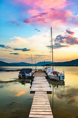 Naklejka na ściany i meble Small Dock and Boats at the lake after sun dawn