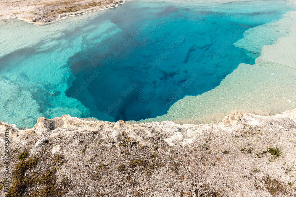 Wall mural Geyser and hot spring in old faithful basin in Yellowstone National Park in Wyoming