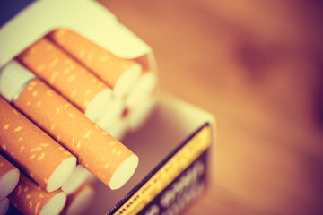 peel it off Cigarette pack prepare smoking a cigarette. Packing line up. photo filters retro old...