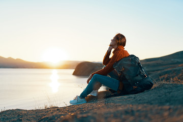 woman with a backpack on nature trip