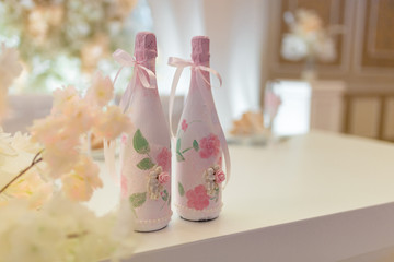 wedding decoration with flowers and champagne bottles