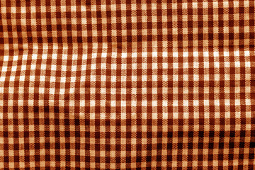 Checked fabric texture in orange tone.