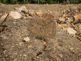 Obraz premium rusty iron grille on a background of sand