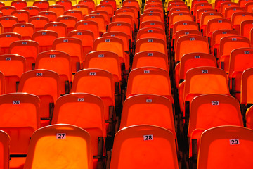 bright orange rows of seats in the stadium