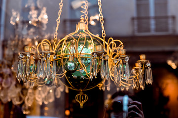 Antique shop in paris. Chandeliers and crystal. The decor and interior in the old style.