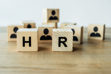 selective focus of hr lettering on wooden cubes on table