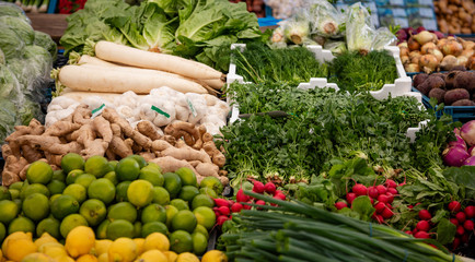 Fresh vegetables and herbs at a local market, background, texture
