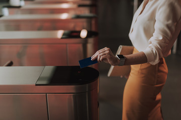 High angle of Caucasian businesswoman keeping card in arm