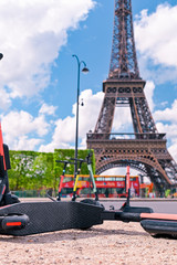 Scooter on the street of Paris. Car rental. Youth trends and fashion technology. The Eiffel Tower.
