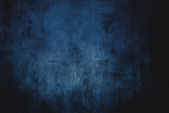 Dark blue grungy wall background or texture