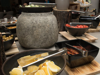 Selection self service continental breakfast buffet display, catering or brunch table food buffet filled with delicious food assortment, cereals, seeds, dried fruits in a hotel or restaurant setting